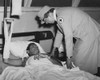 First Lady Eleanor Roosevelt Visits A Wounded Soldier In A South Pacific Military Hospital. Aug.-Sept. 1943. She Was Traveling As A Representative Of The Red Cross History - Item # VAREVCHISL043EC695