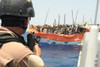 U.S. Sailor Trains His Gun On Over Twenty Suspected Pirates In A Ramshackle Boat The Gulf Of Aden. April 17 2009. History - Item # VAREVCHISL024EC243
