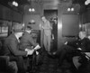 Group Of Men Listening To A Radio In A Railroad Lounge Car History - Item # VAREVCHISL043EC237