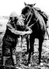 American Soldier Demonstrates Gas Masks For Man And Horse During World War I. Ca. 1917-18. History - Item # VAREVCHISL034EC515