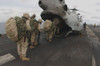 U.S. Marines On The Amphibious Command Ship Uss Bataan Board A Helicopter To Be Deployed In Afghanistan. Dec. 14 2001. History - Item # VAREVCHISL024EC192