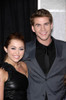 Miley Cyrus, Liam Hemsworth At Arrivals For The Last Song Premiere, Arclight Hollywood Cinerama, Los Angeles, Ca March 25, 2010. Photo By Michael GermanaEverett Collection Celebrity - Item # VAREVC1025MRCGM063