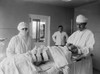 Anesthesiologist And Surgical Nurse With A Post-Operative Patient. A Large Bandage Covers The Incision History - Item # VAREVCHISL043EC215