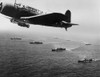 American Military Convoy In The South Atlantic Ocean. A U.S. Vindicator Scout Bomber Flies Anti-Submarine Patrol Over The Convoy. Nov. 27 History - Item # VAREVCHISL036EC260