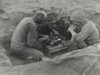 Three U.S. Army Soldiers Eat Rations In A Foxhole During The Battle Of Saipan. Ca. June 15-July 9 History - Item # VAREVCHISL037EC031