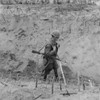 Vietnam War. Us Marine Walks Through A Punji-Staked Gully. Punji Stake Booby Traps Were Made Out Of Wood Or Bamboo History - Item # VAREVCHISL033EC509