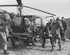 A Seriously Wounded U.S. Marine Is Rushed To Helicopter By The Corpsmen. He Will Receive Emergency Treatment At An Aid Station Located In The Teng-Mak Area In Korea. Feb. 25 History - Item # VAREVCHISL038EC169