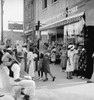 Main Street Shoppers, 1939. /Nafrican American Men And Women Shopping And Socializing On Main Street During A Saturday Afternoon In Pittsboro, North Carolina. Photograph By Dorothea Lange, July 1939. Poster Print by Granger Collection - Item # VARGRC