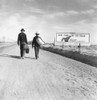 Hitchhikers, 1937. /Ntwo Hitchhikers On Their Way To Los Angeles, California. Beside Them, A Billboard For Southern Pacific Reads, 'Next Time Try The Train, Relax.' Photograph By Dorothea Lange, March 1937. Poster Print by Granger Collection - Item #