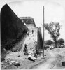 China: Peking, C1902. /Nthe Incline At The Southern Gate, Known As Dead Man'S Climb, With A Chinese Man Sitting At The Entrance, And A Guard And A Westerner In The Background, Peking, China. Stereograph, C1902. Poster Print by Granger Collection - It