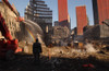 Workers Spray The Still Smoldering Rumble With Water At The World Trade Center Site Six Weeks After The 9-11 Attacks. Orange Netting Covers Damaged Buildings Adjacent To Ground Zero. Oct. 28 2001. Photo Everett Collection History ( x - Item # VAREVCH