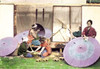 Umbrella manufacturing more on the order of parasols.  This image is from a collection of hand tinted Meiji era photographs from Japan that were published and bound in a rice paper book in multiple volumes. Poster Print by Suzuki - Item # VARBLL05870