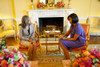 Michelle Obama Talks With Elizabeth Preval The First Lady Of Haiti In The Yellow Oval Room Of The White House. Michelle Wears A Textured Lilac Skirt With A Short Sleeve Trapeze Jacket Fastened With A Diamond Broach. March 10 2010. - Item # VAREVCHISL