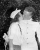Congratulations Kiss, 1939. /Nwalter B. Miller Receiving A Kiss From His Girlfriend Betty Virginia Crews After Being Commissioned As An Ensign At Graduation Exercises At The United States Naval Academy, Annapolis, Maryland. Photograph, June 1939. Pos