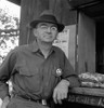 Deputy Sheriff, 1939. /Na Deputy Sheriff Stationed At The Paymaster'S Window For Migrant Workers On A Large Hop Farm In Josephine County, Near Grants Pass, Oregon. Photograph By Dorothea Lange, August 1939. Poster Print by Granger Collection - Item #