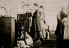 This little girl like many others in this state is so small she has to stand on a box to reach her machine. She is regularly employed as a knitter in Loudon Hosiery Mills. Said she did not know how long she had worked there. Poster Print - Item # VAR