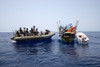 U.S. Navy And Coast Guard Counter Piracy Personnel Approach A Suspect Vessel While Under Way In The Gulf Of Aden. The Suspected Ramshackle 'Mother' Ship Has An Outboard Engine Boat That Could Be Used To Attack Vessels. June 2 2009. - Item # VAREVCHIS