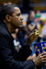 President Barack Obama Eats Popcorn While Watching A College Basketball Game Between Oregon State Which Is Coached By His Brother-In-Law Craig Robinson And George Washington University In Washington D.C. Nov. 28 2009. History - Item # VAREVCHISL025EC