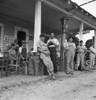 Fourth Of July, 1939. /Na Group Of Men Hanging Out At A Small Fuel Filling Station With Some Of The Men Wearing The Local Team'S Baseball Uniforms On The Fourth Of July, Near Chapel Hill, North Carolina. Photograph By Dorothea Lange On 4 July 1939. P