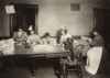 Hine: Home Industry, 1912. /Na Mother And Her Young Children Doing Piecework For Garments, Often Until 9 P.M. At Night In A Tenement Home In Worcester, Massachusetts. Photograph By Lewis Hine, November 1912. Poster Print by Granger Collection - Item