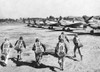 U.S. Flying Tiger Pilots Run To Their Fighter Planes At An Advanced U.S. Base In China. They Will Pursue Japanese Bombers Conducting An Air Raid In Their Area. They Are U.S. Volunteers Recruited And Commanded By Claire Lee Chennault - Item # VAREVCHI