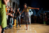 First Lady Michelle Obama Plays Hopscotch During The 'Make A Difference' Program At The University Of Mumbai In Mumbai India. Michelle Wears A Tiered Floral Skirt And Moss Olive Lace Top By J. Crew And A Broach By Erickson Beamon. - Item # VAREVCHISL