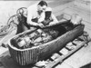 Howard Carter (1873-1939). /Nenglish Archaeologist. Carter And An Egyptian Assistant Examining The Sarcophagus Of King Tutankhamen, Found During The Excavation Of His Tomb In The Valley Of The Kings, Egypt, October 1925. Photographed By Harry Burton.