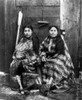 Alaska: Tlingit Women, C1900. /Ntwo Tlingit Women, Wearing Robes Of Eider Duck Feather And Marmot Skin, Seated In Front Of A Wooden Partition With Baskets And Carved Wooden Items. Studio Portrait, Sitka, Alaska, C1900. Poster Print by Granger Collect