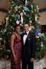 President And Michelle Obama Pose In Front Of The Official White House Christmas Tree Dec. 5 2010. Michelle Wears A Scarlet Floral Sequined Gown By Naeem Khan And Earrings Of Rough Diamonds In Oxidized White Gold By Bochic. History ( - Item # VAREVCH