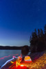 A campfire built on a beach at dusk next to a glowing tent and headlamp light trails, tranquil ocean water reflecting the warm light, Hesketh Island; Homer, Alaska, United States of America Poster Print by Kevin G. Smith / Design Pics - Item # VARDPI