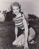 Anne Francis - Kneeling in Grass Photo Print (8 x 10) - Item # DAP11263