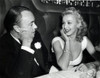 Carole Landis - sitting at table with man Photo Print (10 x 8) - Item # DAP14415