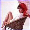 Claudia Cardinale - Wicker Chair Color Photo Print (8 x 10) - Item # DAP15557