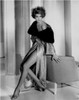 Cyd Charisse - sitting on back of chair in robe Photo Print (8 x 10) - Item # DAP15699