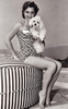 Debbie Reynolds- Sitting holding a puppy Photo Print (8 x 10) - Item # DAP16510