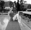 Debbie Reynolds- Sitting in one piece legs up Photo Print (10 x 8) - Item # DAP16431