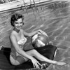 Debbie Reynolds- Sitting on pool float with ball Photo Print (8 x 10) - Item # DAP16468