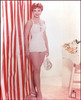Debra Paget- Standing next to red and white striped wall Photo Print (8 x 10) - Item # DAP16540