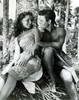 Debra Paget- tropical dress sitting next to man Photo Print (8 x 10) - Item # DAP16730