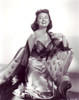 Donna Reed - In Dress Kneeling on Chair Photo Print (8 x 10) - Item # DAP17049