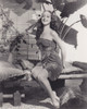 Dorothy Lamour - Holding Flower in Her Hair Photo Print (8 x 10) - Item # DAP17229