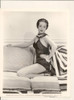 Dorothy Lamour - Kneeling on Couch/ Hand on Hip Photo Print (8 x 10) - Item # DAP17213