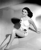 Dorothy Malone - Sitting in Floral One-Piece Photo Print (8 x 10) - Item # DAP17360