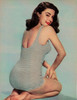Elaine Stewart - Kneeling/ Looking Over Shoulder in Stripped SwimSuit Photo Print (8 x 10) - Item # DAP17605