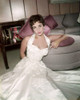 Elizabeth Taylor - Sitting on Floor in Dress Leaning on Ottoman Photo Print (8 x 10) - Item # DAP17735