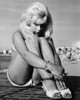 Elke Sommer - Curled up on the Beach Photo Print (8 x 10) - Item # DAP17954