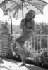 Elke Sommer - Holding Umbrella Smiling with head tilt Photo Print (8 x 10) - Item # DAP18124