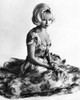 Elke Sommer - Kneeling in Floral Dress Photo Print (8 x 10) - Item # DAP17945