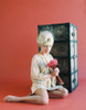 Elke Sommer - Sitting on Floor Holding Red Flowers Photo Print (8 x 10) - Item # DAP17887