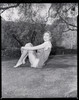 Grace Kelly - Sitting Holding Knees on Grass Photo Print (8 x 10) - Item # DAP18321